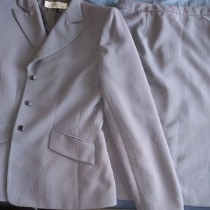 Gray blazer with matching skirt.
